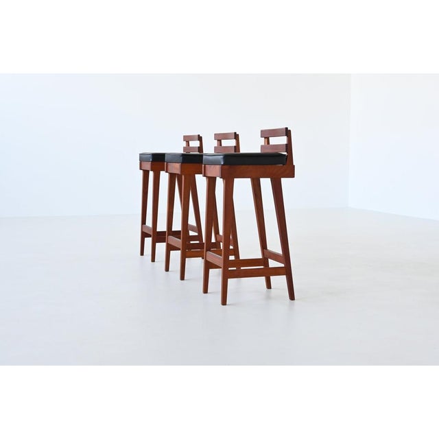 Fantastic set of three bar stools designed by Erik Buck for Dyrlund, Denmark 1960. These bar stools embodies Danish...