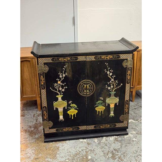 Design Plus Gallery presents a Vintage Lacquered Chinoiserie Dry Bar. The cabinet has a black lacquered wood exterior...