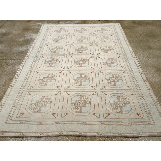 A vintage Turkish Anatolian accent rug handmade during the Mid-20th century. Measures: 6' 7" x 9' 5"