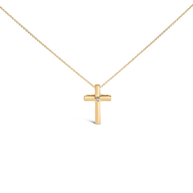 Grace takes a luminous, modern form in this petite cross, its smooth, rounded bars bathed in rich 24‑karat gold vermeil...