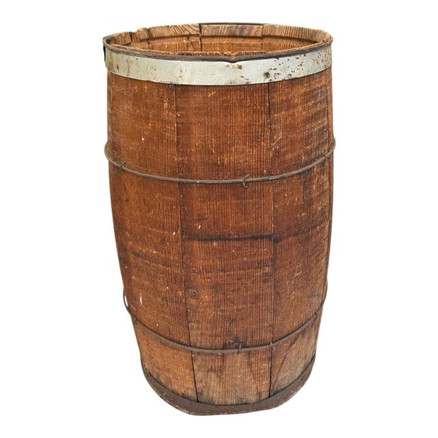 Primitive antique wooden nail keg barrel featuring rustic wood staves with metal bands and aged farmhouse character. Great...