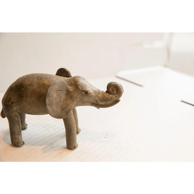 :: Vintage handmade African elephant sculpture. Circa late mid 20th century, though possibly older, this piece has such...