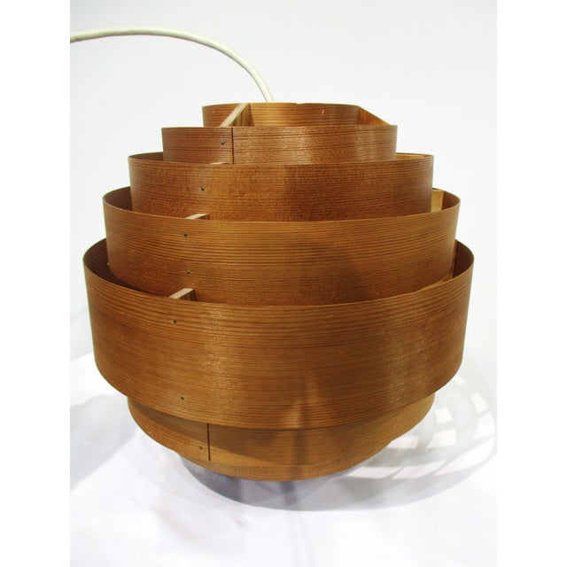 A very well crafted teak wood veneered " Ellysett" pendent ceiling lamp designed by Hans- Agne Jakobsson. Made in Sweden...