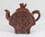 Vintage brown Chinese clay tea pot with bird and dragon motif. Makers stamp inside lid and on the bottom. One very small...