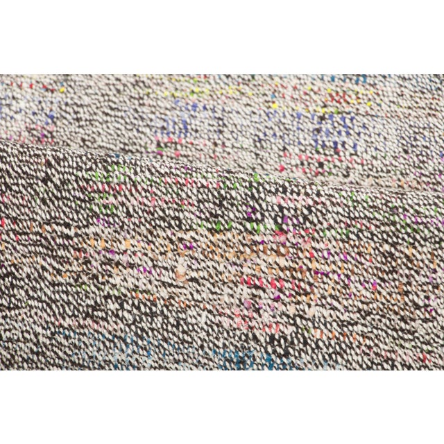 Handwoven in wool and originating circa 1950-1959, this 6x9 vintage Turkish Chaput kilim rug joins Rug & Kilim’s Kilim &...