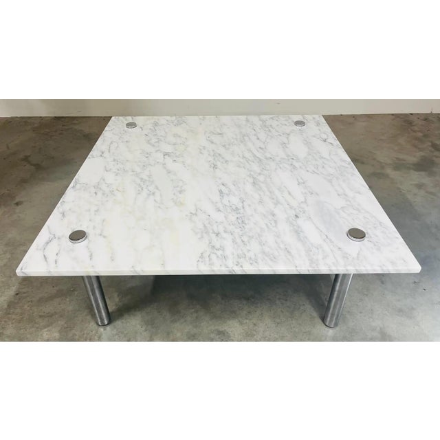 A beautiful and exceptionally rare mid-century modern Carrara marble and chromed steel square cocktail table in the manner...