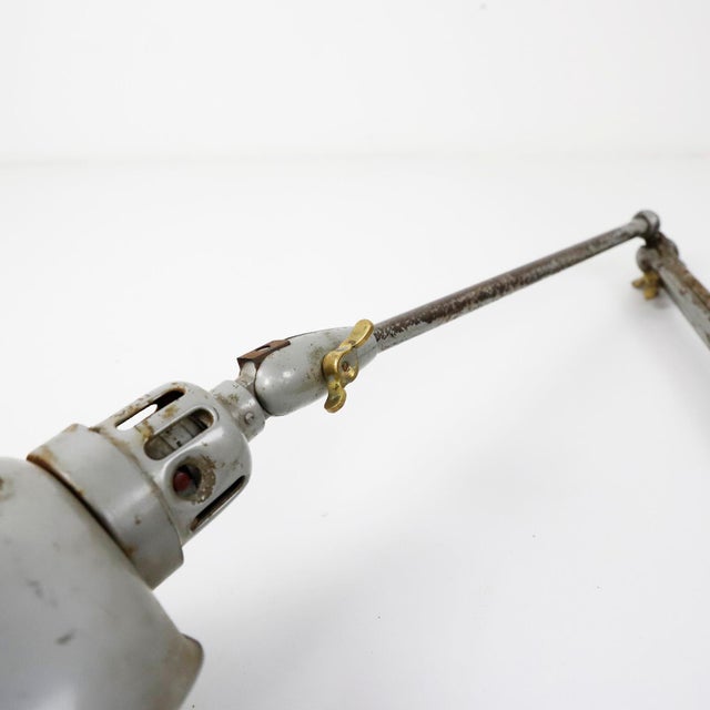 We offer this Vintage industrial adjustable desk table lamp. Measures: circa 1940.
