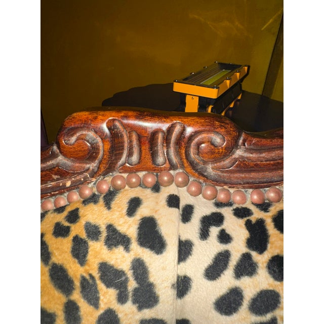 Vintage Rococo Revival chaise lounge featuring a beautifully hand-carved solid wood frame and striking leopard velvet...