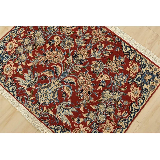 An authentic vintage traditional Nain rug, hand-knotted using fine wool with silk highlights and natural dyes. This...
