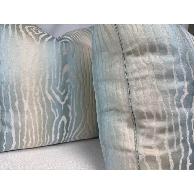 Custom pair of 22" pillows covered in Thibaut "Traduizione" in robin's egg fabric and corded in a a Samuel & Sons micro...