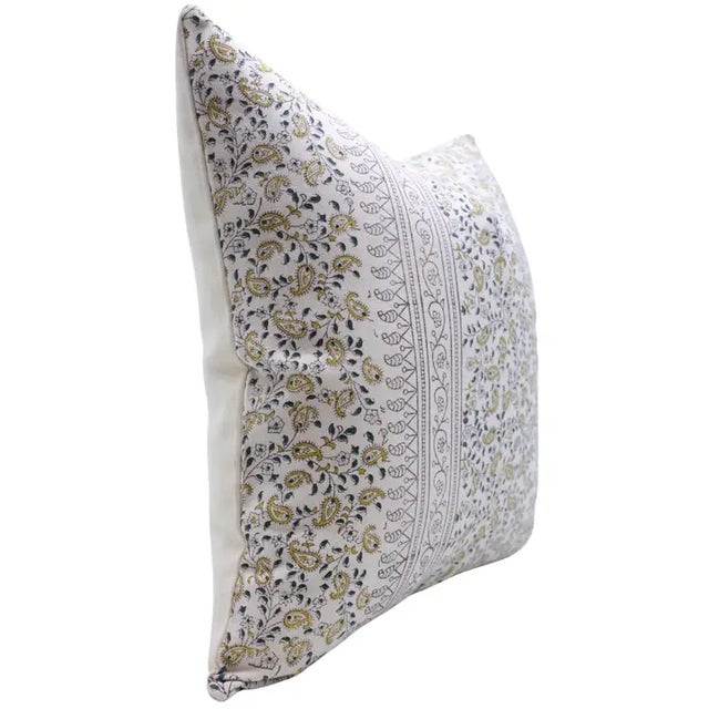 Blending tradition with sophistication, the Kerijaal Border cushion cover showcases a detailed hand block printed mango...