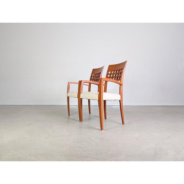 Beautiful set of two dining chairs from the traditional German manufacturer WK Wohnen for sale. These armchairs impress...