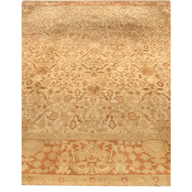 An early 20th century North Indian Amritsar antique rug, the sand field with a beige and cocoa palmette formed medallion...