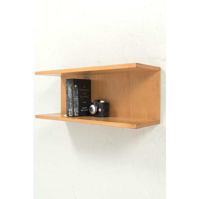 A nice vintage wall shelf made or blonde veneer. The wall shelf has some traces of use on the corners (see photos 7 and...
