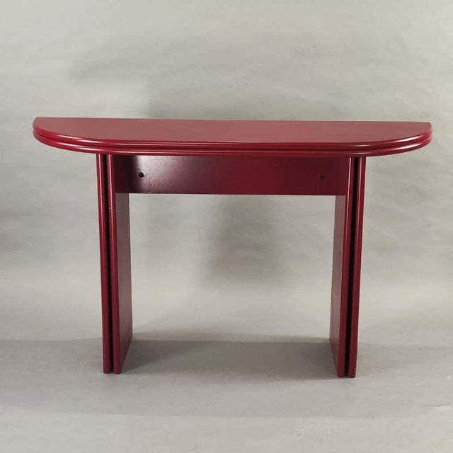 Bordeaux lacquered folding console table with a post-modern design from the 1980s. Bordeaux red lacquered wood structure...
