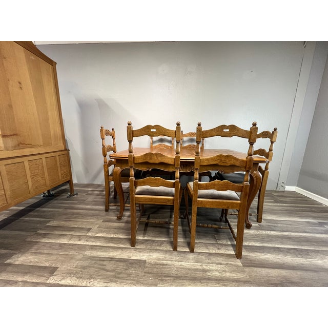 Transform your dining room with this stunning Mid Century Belgian Light Oak Table and 6 Chair Set with extension leaves....