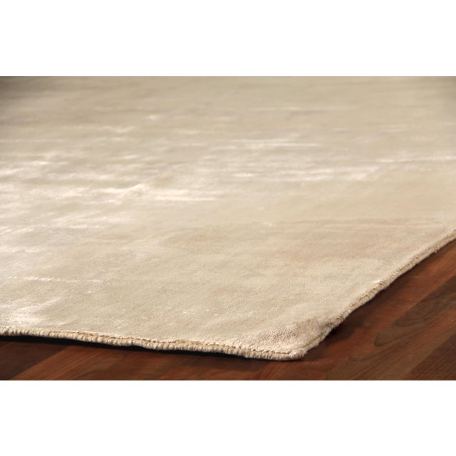 The beautiful tone on tone color striations and luxurious pile is the foundation to our Arras Collection. Each rug is...