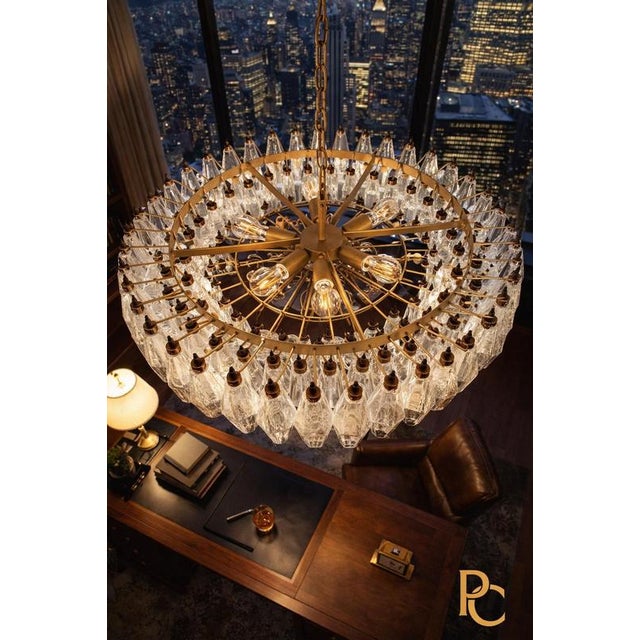 Elegant pair Italian pendant lights each made from 185 trasparent Murano glasses "poliedri". Structure in gold and brass...