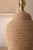 A beautifully textured rope-wrapped table lamp that brings warmth and natural character to any space. The sculptural,...