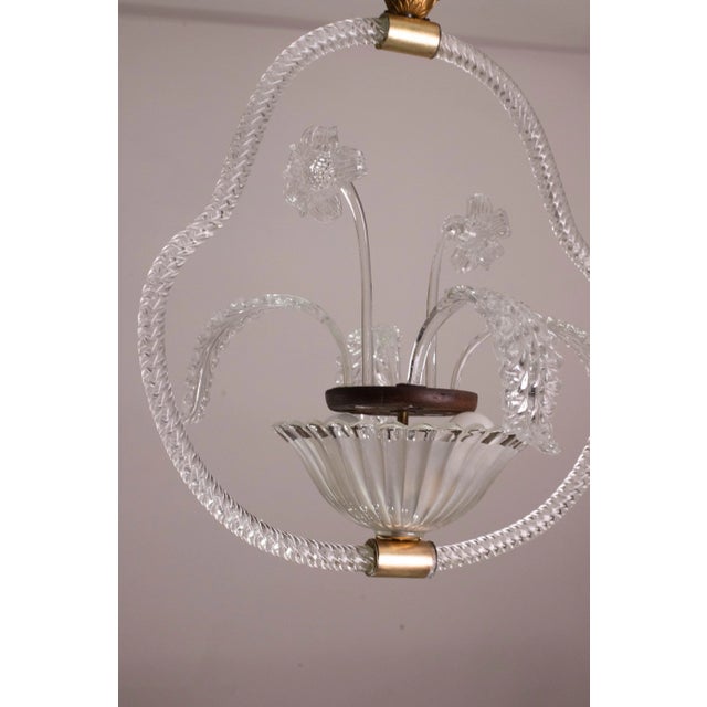 Unique pair of Murano chandeliers, Barovier and Toso glassworks, one blue and one rare transparent with flower and leaf...