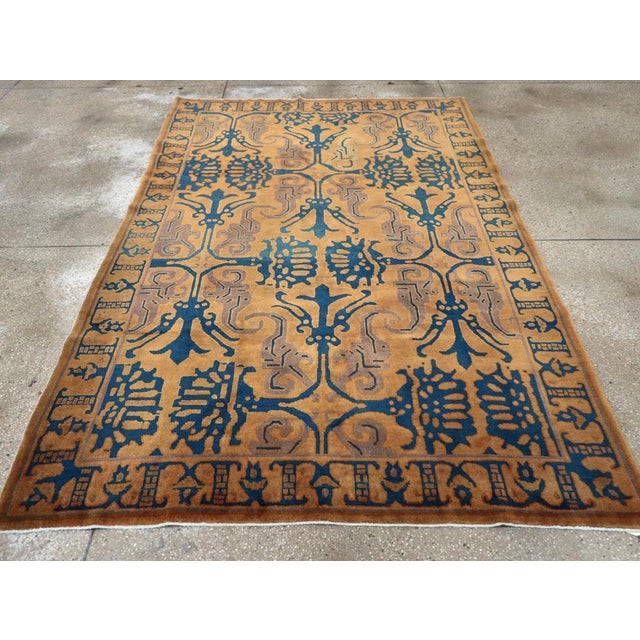 A vintage Chinese Art Deco accent carpet handmade during the mid-20th century. Measures: 6' 1" x 8' 11"
