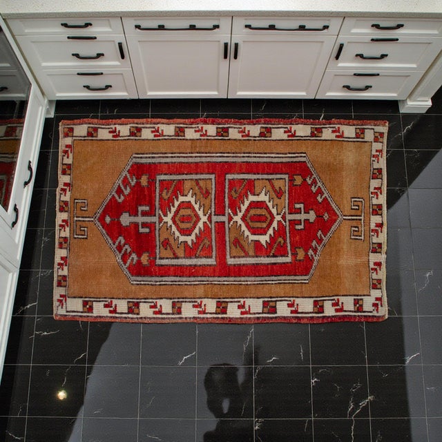 Vintage Turkish Hand-Knotted Small Rug / Doormat from Oushak, 1980, featuring warm brick-red and camel-toned accents and...