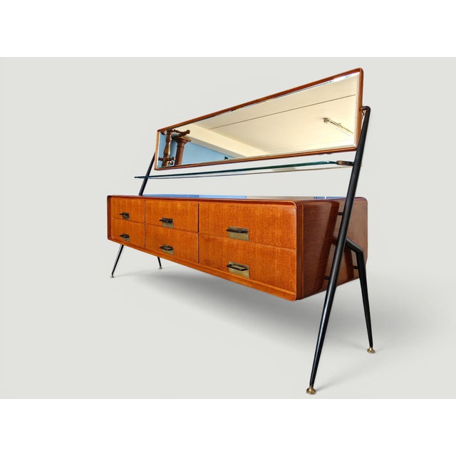 This elegant sideboard designed by Silvio Cavatorta in the 1950s, is a remarkable example of Italian Mid-Century Modern...
