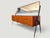 This elegant sideboard designed by Silvio Cavatorta in the 1950s, is a remarkable example of Italian Mid-Century Modern...
