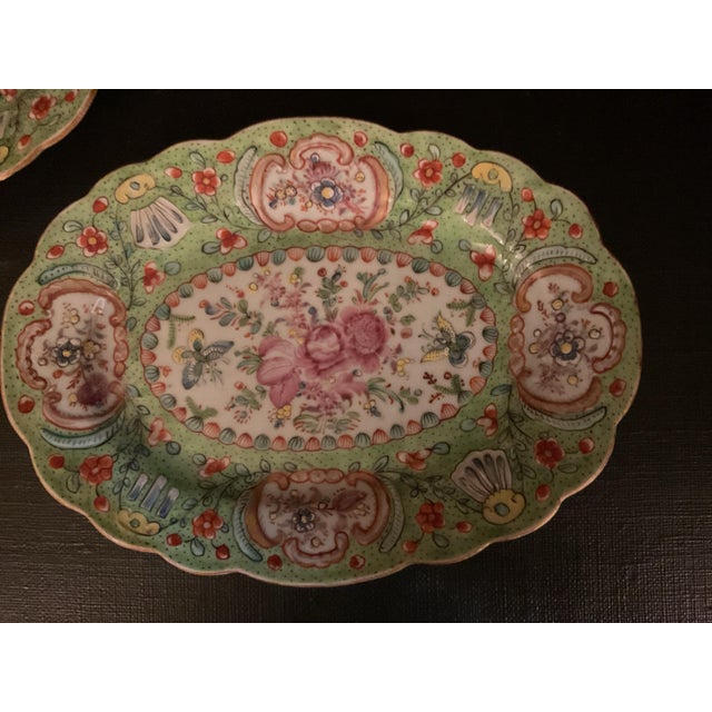 Beautifully decorated pair of porcelain clobbered serving dishes or small platters, likely made in the 18th Century Rococo...