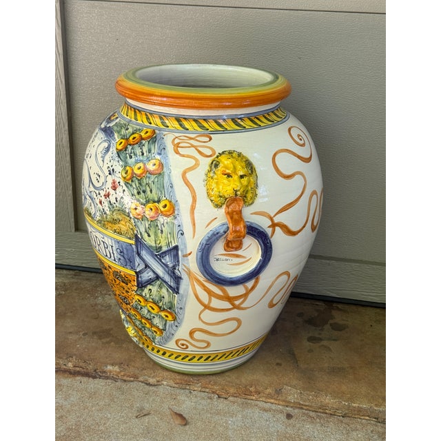Striking oversized hand-painted ceramic floor urn measuring approximately 21” high. The piece features elaborate...