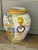 Striking oversized hand-painted ceramic floor urn measuring approximately 21” high. The piece features elaborate...