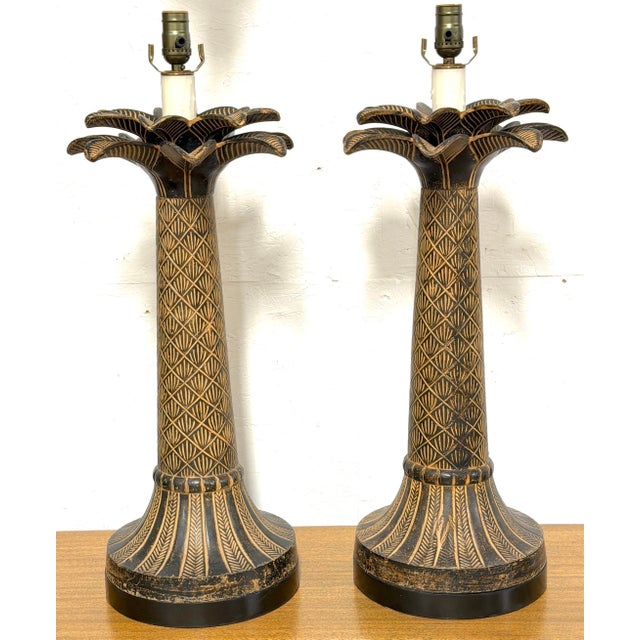 Pair of British Colonial-Style Bronze Palm Tree Lamps with Carved Tribal Motifs A striking and highly decorative pair of...