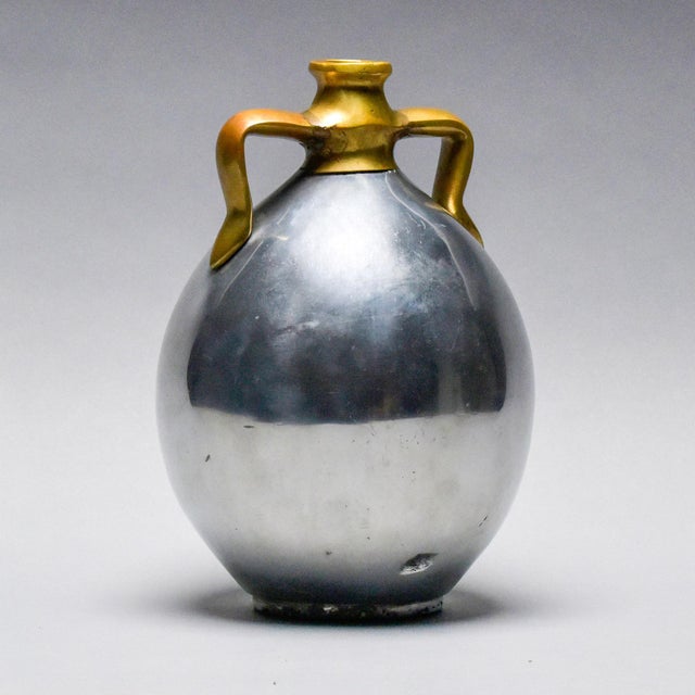 Found in Spain, this brutalist style aluminum and brass jug style vase is attributed to Alfonso Marquez and dates from the...