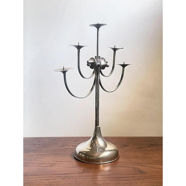 An expressive example of late 20th-century Hungarian metalwork, characterized by five sweeping curved arms arranged at...