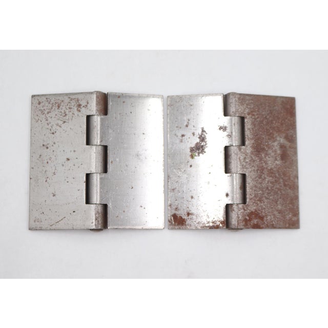 Vintage blank steel door hinges with flat tips, five knuckles, and no hole pattern. Good condition with surface wear and...