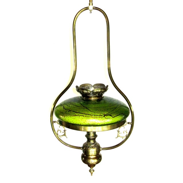 This very large ceiling lamp was originally operated with kerosene and has been electrified. The large lampshade from...