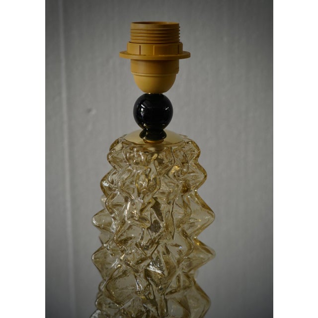 Elegant and very original table lamp designed by Murano glassworks, with a very strong, rich and present character, which...