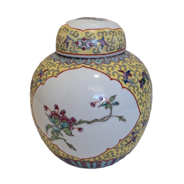 Yellow glaze with the Baoxiang flower and lotus branch motif; two windows feature flowers and a bird; hand-painted around...