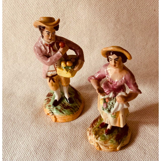 For your consideration... A delightfully romantic pair of circa 1900 Staffordshire lovers that capture the whimsical...