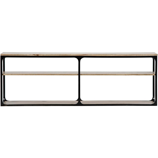 These console tables have each been handcrafted of walnut and are paired with minimally finished metal, creating an...