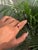 This solitaire ring features a 1.75 carat round-cut natural ruby set in 14K yellow gold. The striking natural ruby in a...