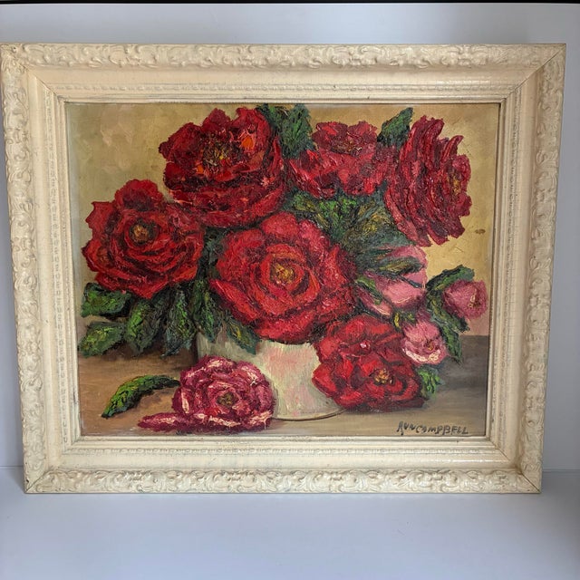 Striking vintage signed floral still life painting featuring a lush arrangement of deep red and pink roses in a simple...