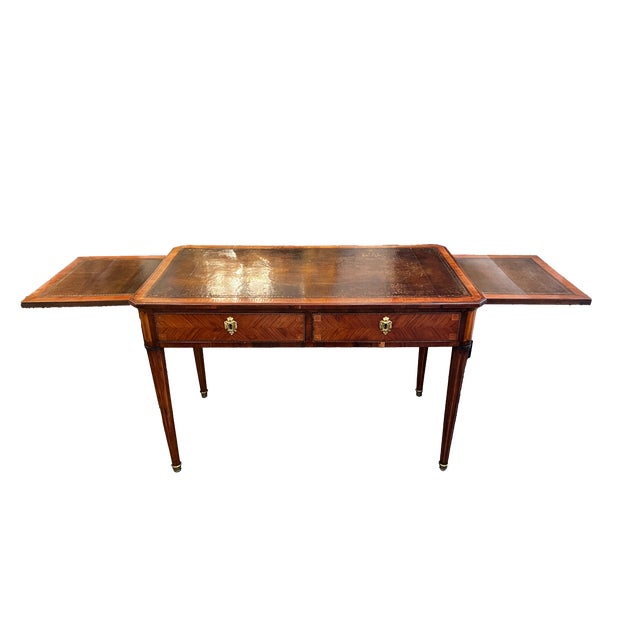 This two drawer writing desk offers two lateral pull-out slides and a rich mahogany finish. The top of the desk features a...