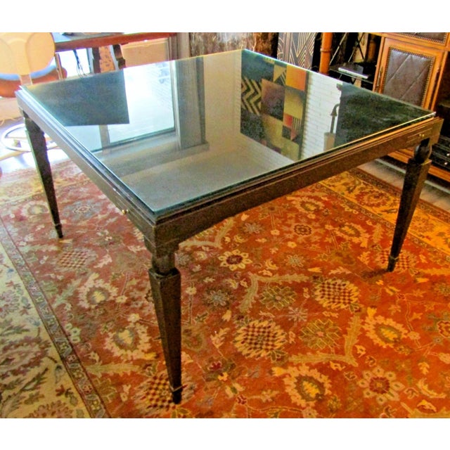 The Vintage Mattaliano Large Casino Game Table features a dark wood base with a glass top, measuring 48" square. This...