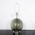 Spherical smoked glass table lamp with nickel hardware.