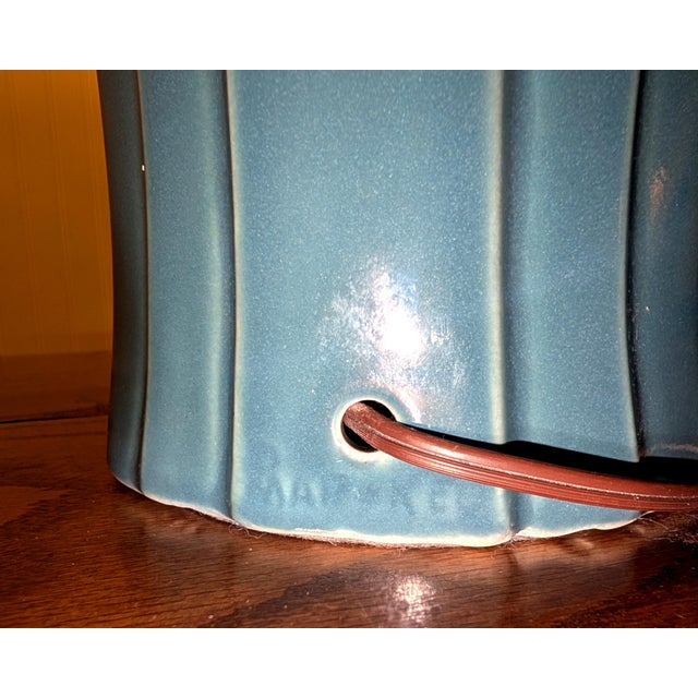 This pair of teal ceramic art deco lamps are in great shape, and would make the perfect statement piece in your space....