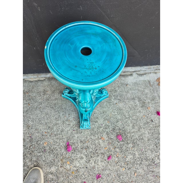 Stand out 19th Century French pedestal or plant stand crafted in terra cotta with an alluring blue glaze featuring three...