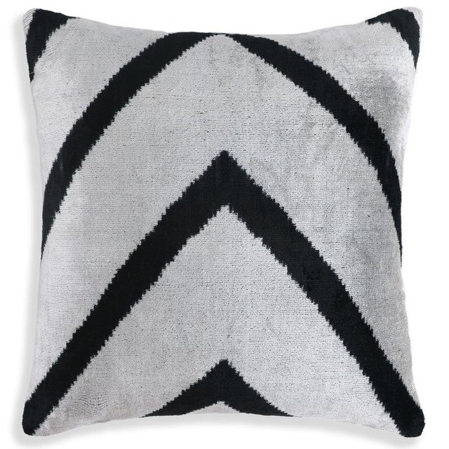 "This 16x16 inch handmade throw pillow showcases a bold, clean chevron “V” design in high-contrast black and white....