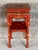 Fabulous vintage side table. Lacquered red with ornate detailing. Chinoiserie feel with Ming style legs. Perfect for a...