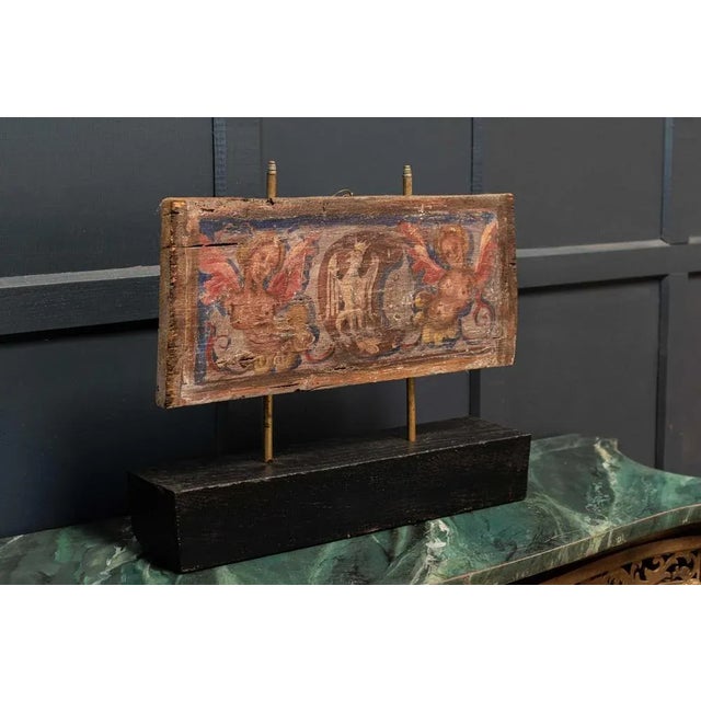 Antique circa 1680. 17thc polychrome painted ceiling panel Mounted on a later block Measures: W48 x D11 x H39.5cm.